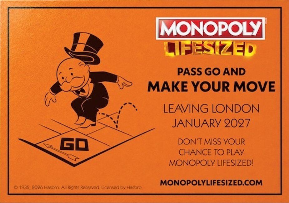 A Monopoly Lifesized board scene with city buildings