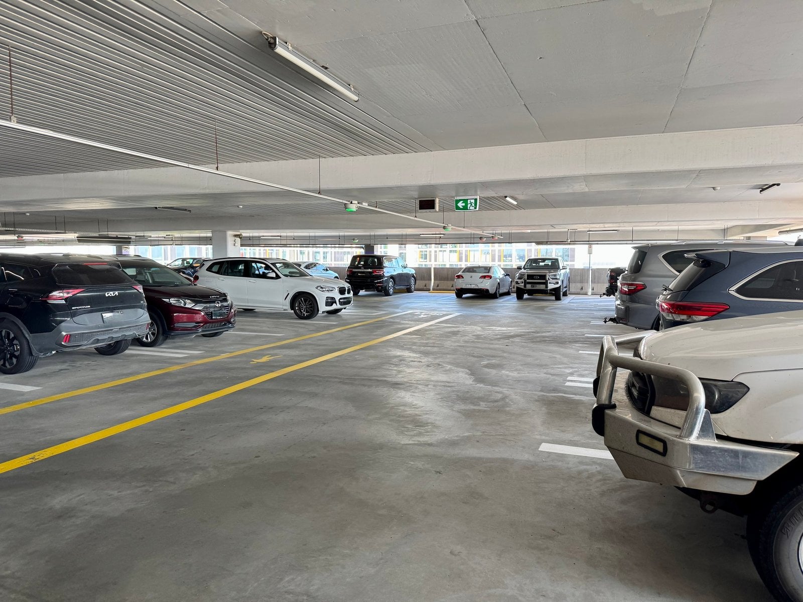 Interior of a multi-level terminal car park with marked parking bays