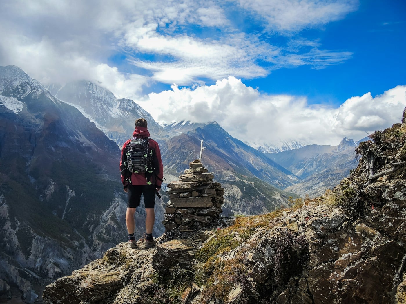 Hiker overlooking mountains